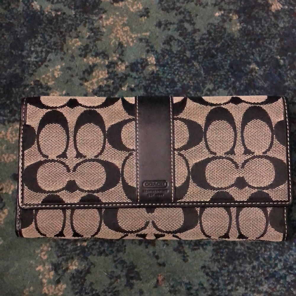 Coach black/beige trifold coin wallet.